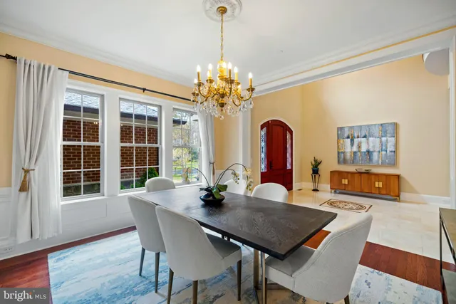 a view of a dining room with furniture and window