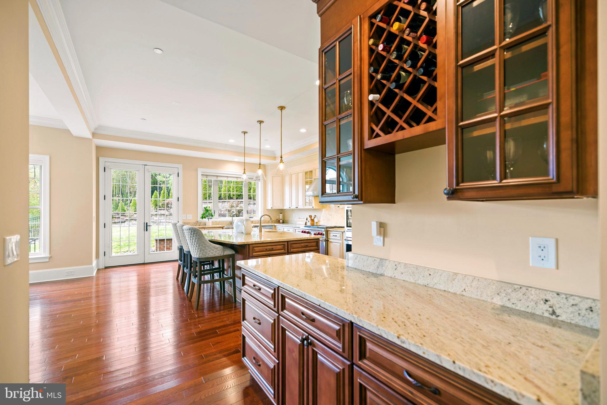 7708 Beech Tree Road Bethesda, MD 20817 - Photo 7 of 55 a kitchen with stainless steel appliances granite countertop a sink and cabinets