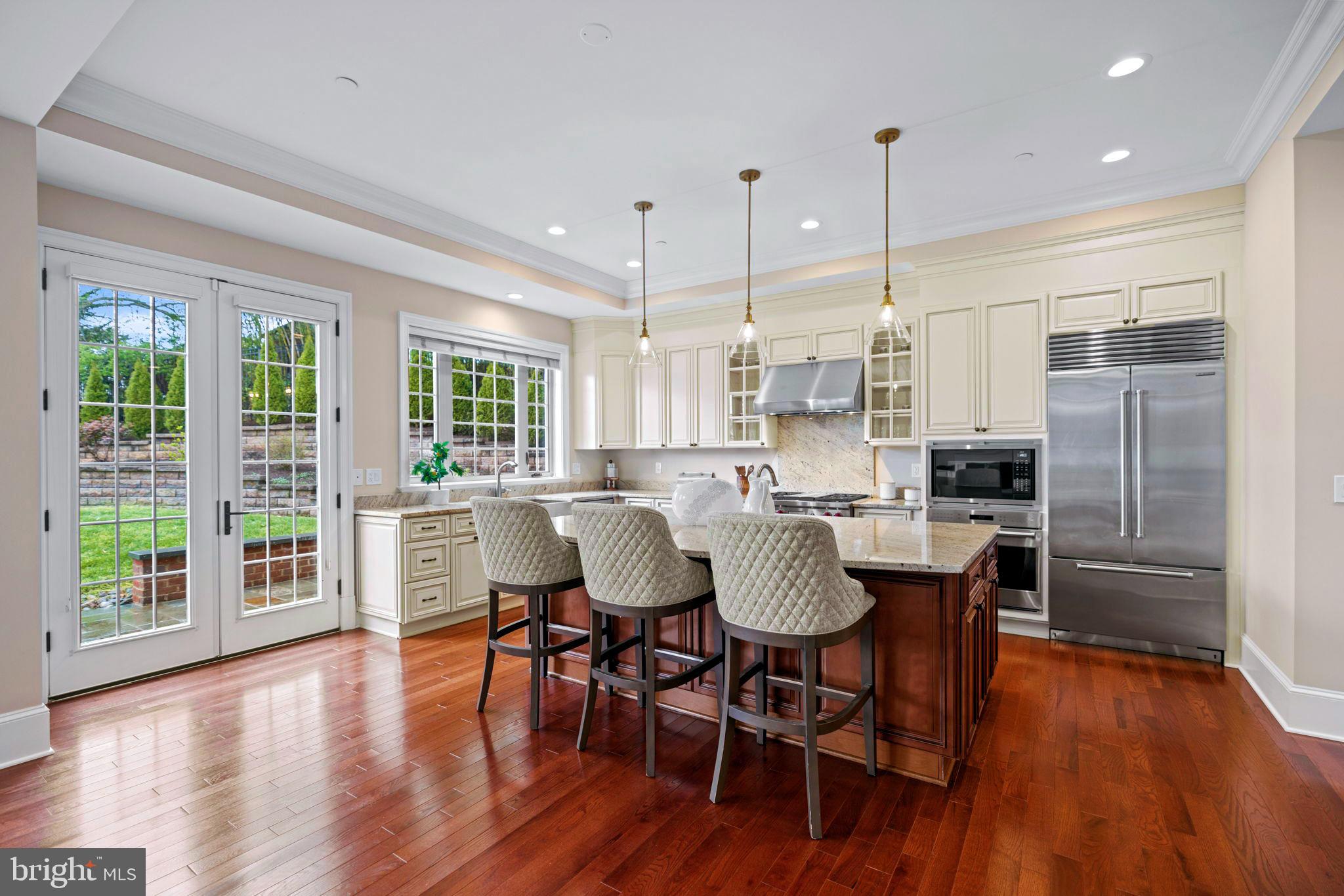 7708 Beech Tree Road Bethesda, MD 20817 - Photo 8 of 55 a view of a dining room with furniture window and wooden floor