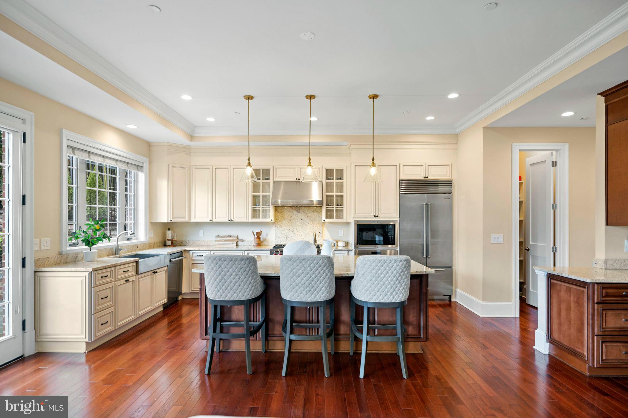 7708 Beech Tree Road Bethesda, MD 20817 - Photo 10 of 55 a view of a dining room with furniture window and wooden floor