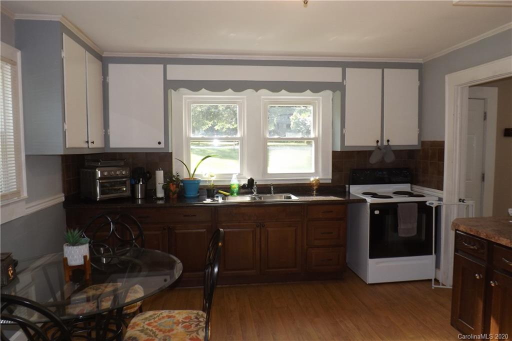 1760 Briggs Road Salisbury, NC 28147 - Photo 14 of 20 a kitchen with stainless steel appliances granite countertop a stove a sink and a refrigerator