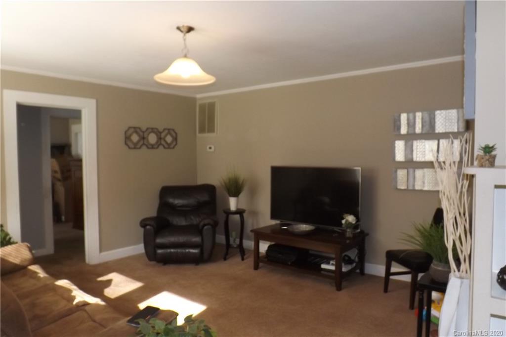 1760 Briggs Road Salisbury, NC 28147 - Photo 16 of 20 a living room with furniture and a flat screen tv