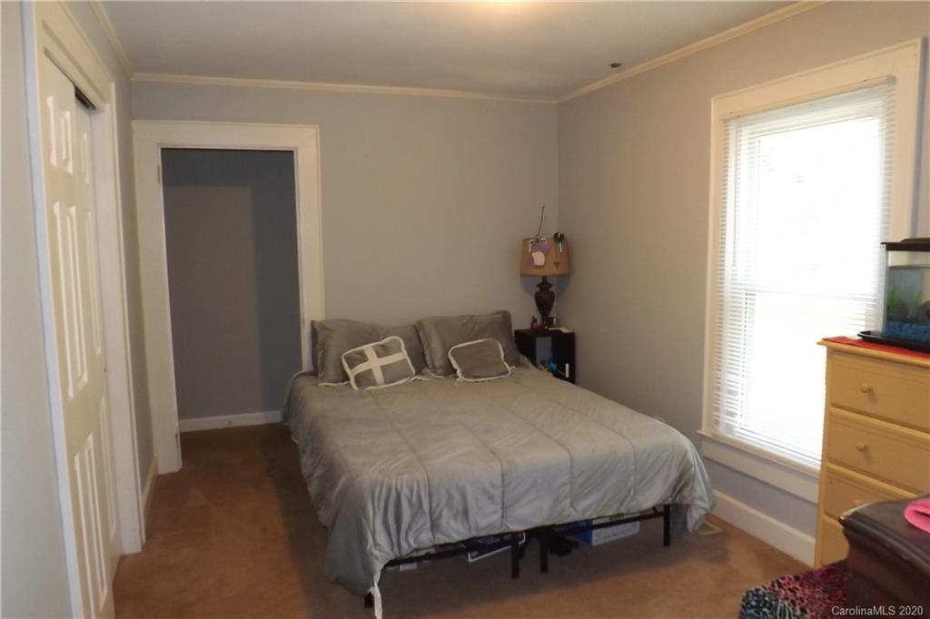 1760 Briggs Road Salisbury, NC 28147 - Photo 18 of 20 a bedroom with a bed and a window