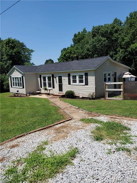 1760 Briggs Road Salisbury, NC 28147 - Photo 3 of 20 a front view of a house with a garden and trees