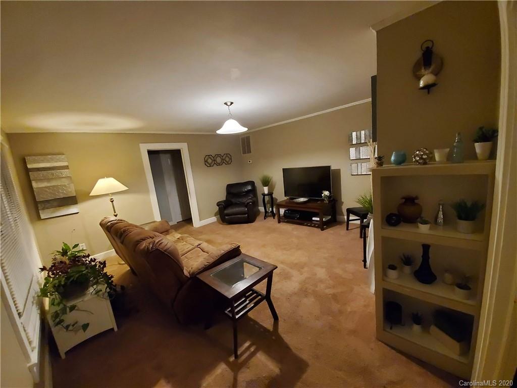 1760 Briggs Road Salisbury, NC 28147 - Photo 5 of 20 a living room with furniture and a flat screen tv