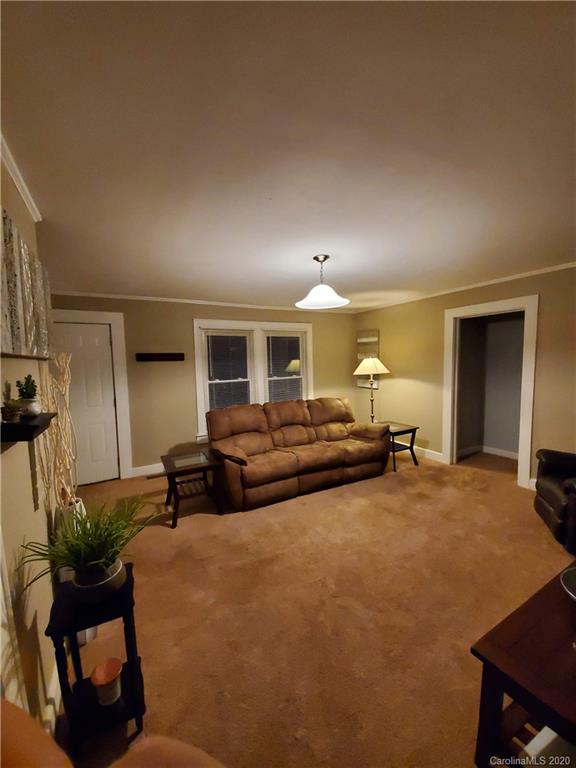 1760 Briggs Road Salisbury, NC 28147 - Photo 6 of 20 a view of a livingroom with furniture and a flat screen tv