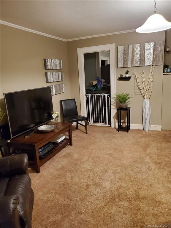 1760 Briggs Road Salisbury, NC 28147 - Photo 7 of 20 a living room with furniture and a flat screen tv