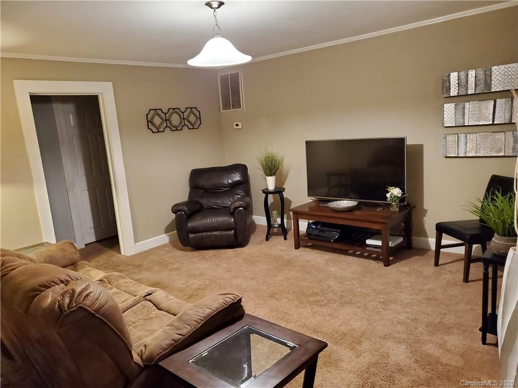 1760 Briggs Road Salisbury, NC 28147 - Photo 8 of 20 a bedroom with furniture and a flat screen tv