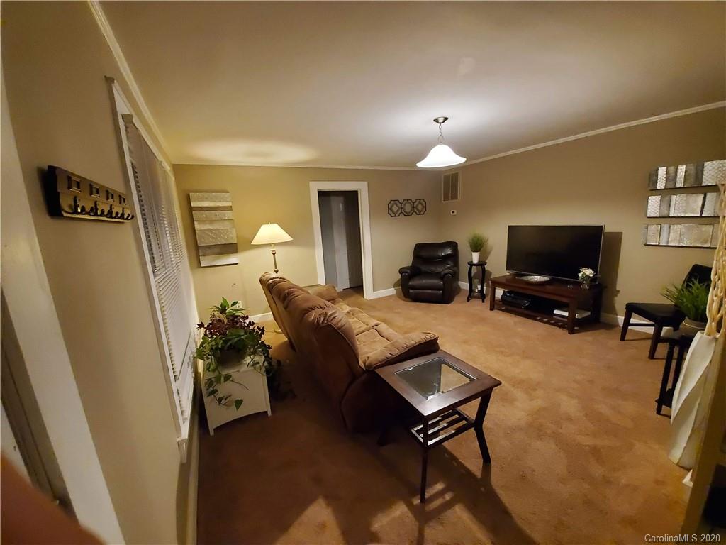 1760 Briggs Road Salisbury, NC 28147 - Photo 9 of 20 a living room with furniture and a flat screen tv