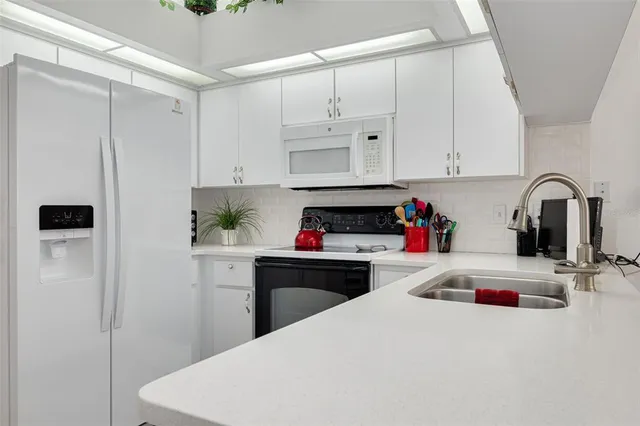 a bathroom with a sink double vanity and mirror