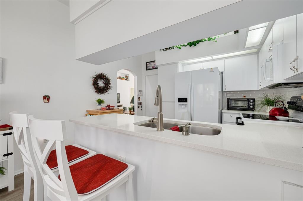 4245 Avanti Circle New Port Richey, FL 34655 - Photo 13 of 28 a bathroom with a sink double vanity and mirror