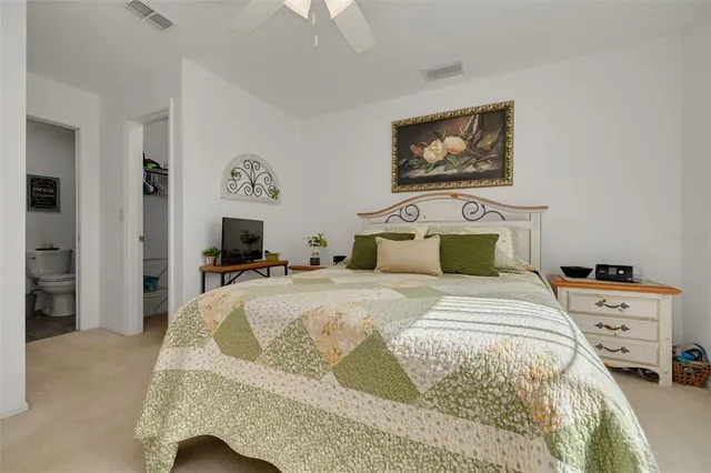 a bedroom with a bed and a couch