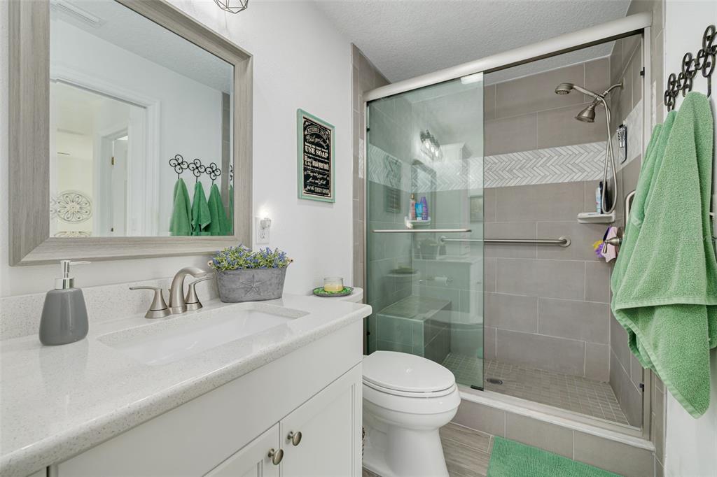 4245 Avanti Circle New Port Richey, FL 34655 - Photo 19 of 28 a bathroom with a sink toilet and shower