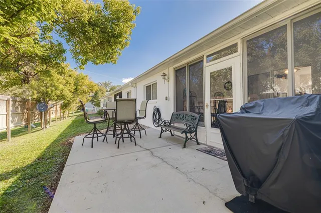 a view of a chairs and table in the patio