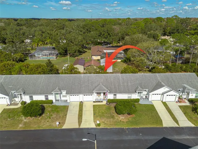 an aerial view of a house with a garden