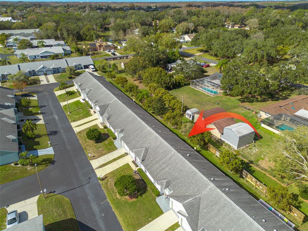 4245 Avanti Circle New Port Richey, FL 34655 - Photo 27 of 28 an aerial view of a house with a garden