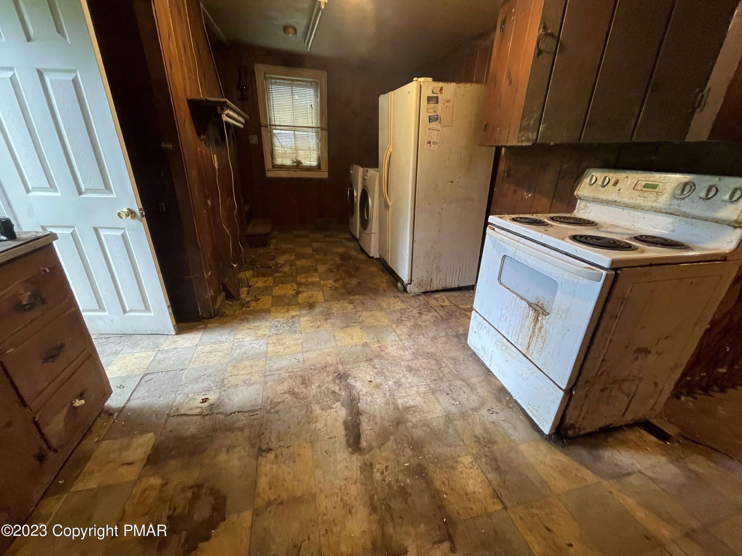 1369 Mutton Hollow Road Stroudsburg, PA 18360 - Photo 6 of 8 a view of a storage & utility room with refrigerator
