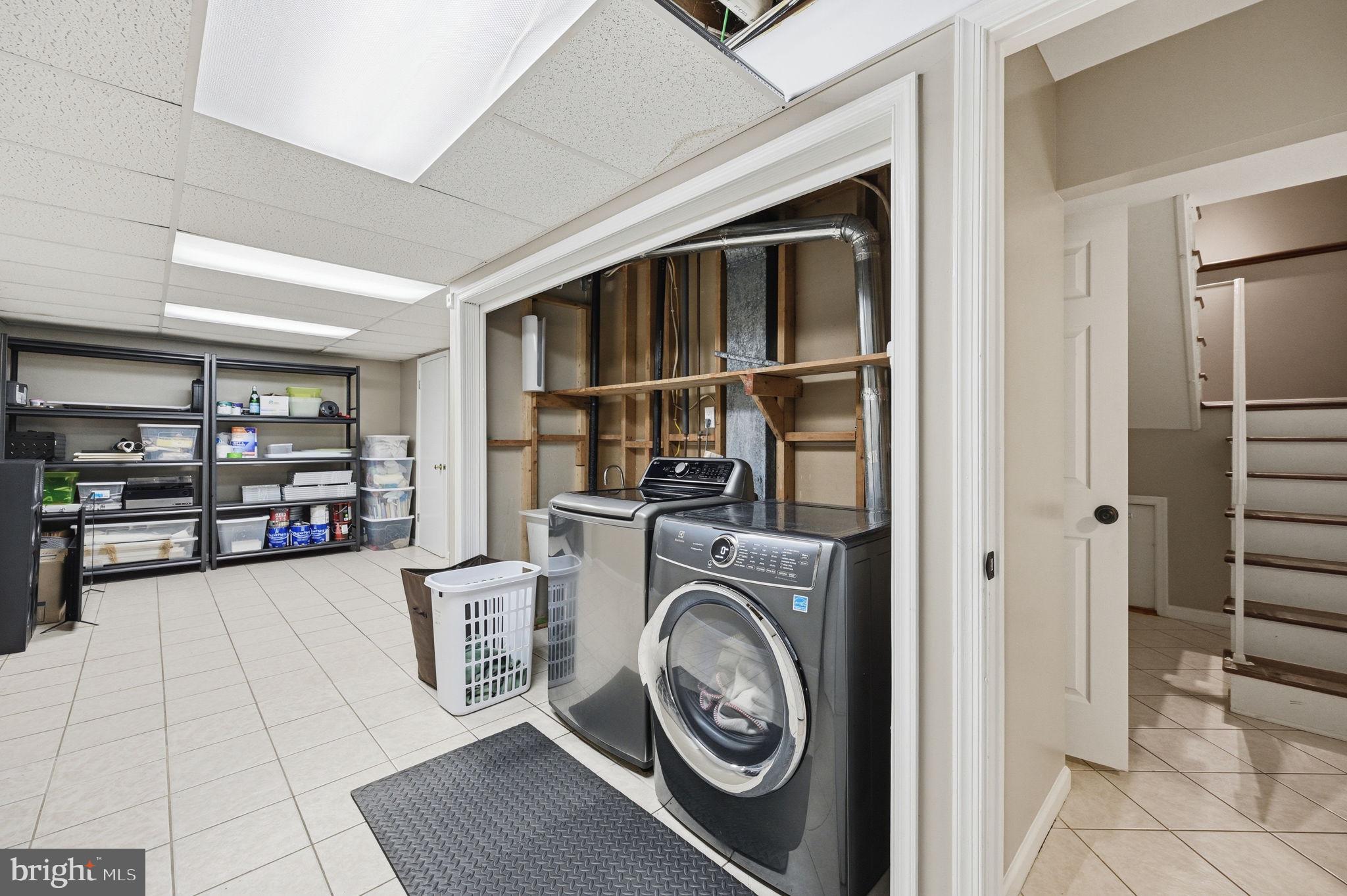 2506 Pinoak Lane Reston, VA 20191 - Photo 27 of 33 a view of a storage & utility room with washer and dryer