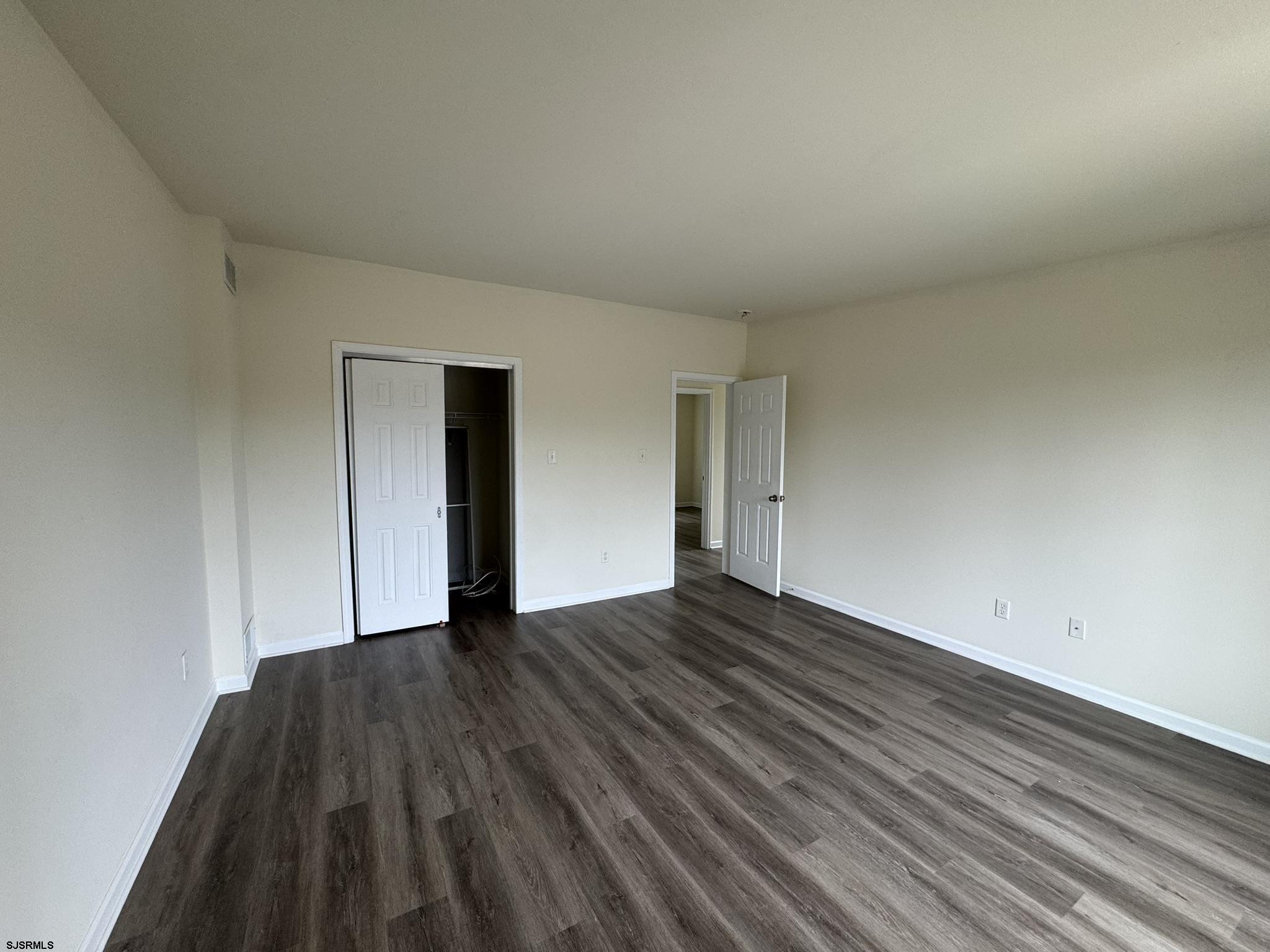 2192 West Avenue, Unit RIGHT SIDE Linwood, NJ 08221 - Photo 14 of 23 a view of an empty room and wooden floor