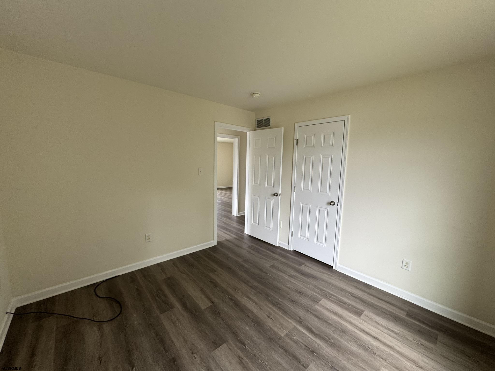 2192 West Avenue, Unit RIGHT SIDE Linwood, NJ 08221 - Photo 19 of 23 a view of an empty room and wooden floor