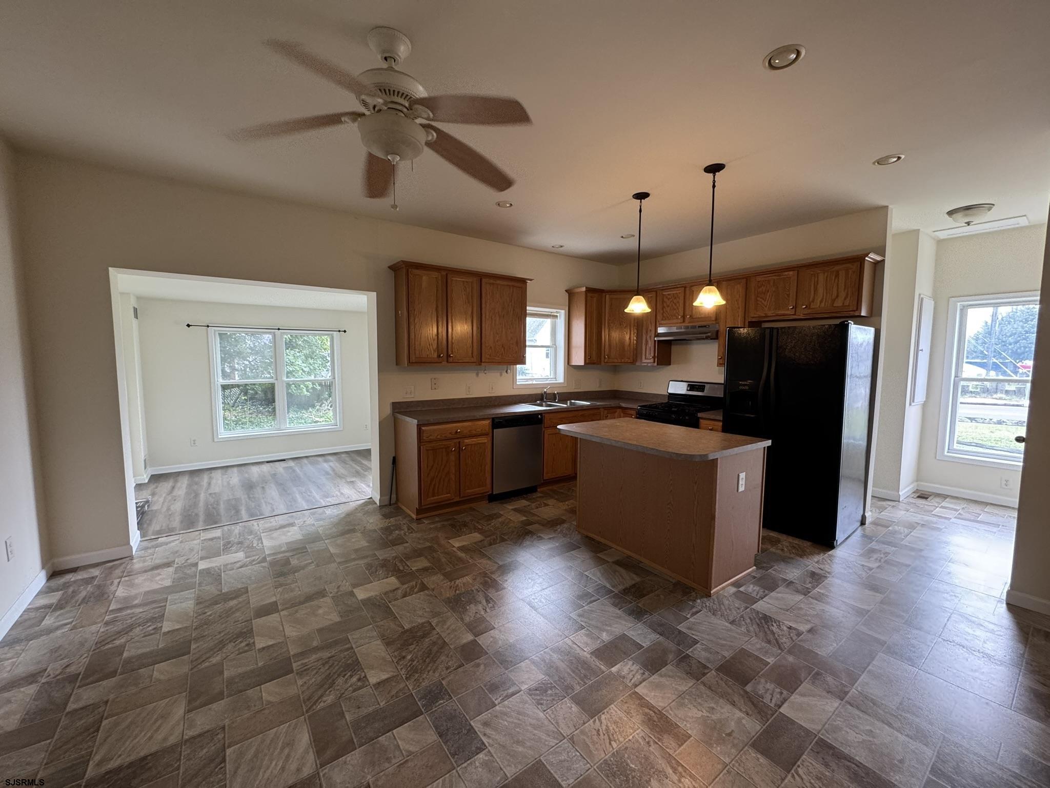 2192 West Avenue, Unit RIGHT SIDE Linwood, NJ 08221 - Photo 2 of 23 a large kitchen with stainless steel appliances kitchen island granite countertop a refrigerator a stove a sink and a microwave