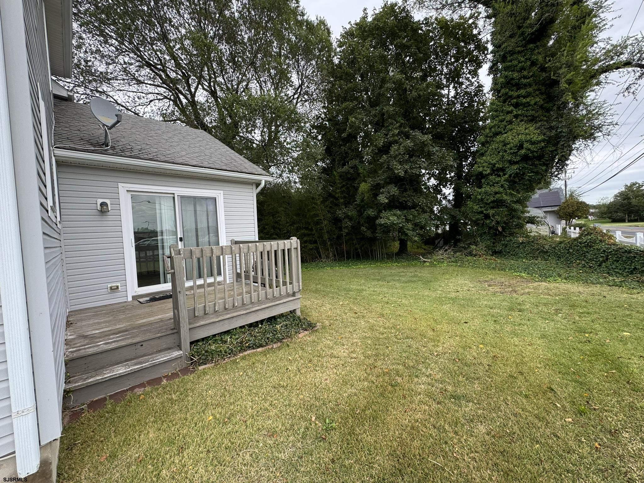 2192 West Avenue, Unit RIGHT SIDE Linwood, NJ 08221 - Photo 21 of 23 a view of a house with a yard and deck