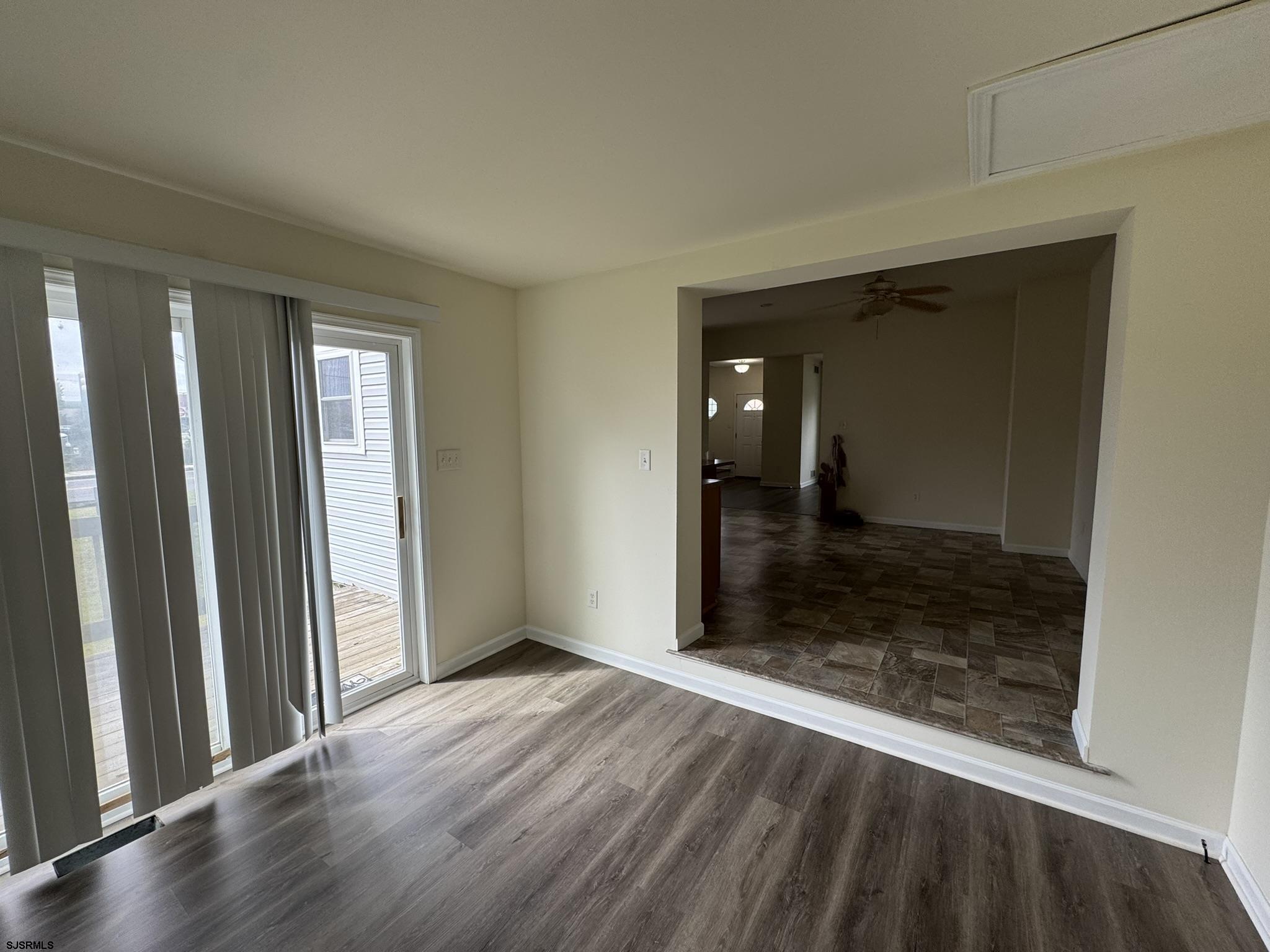 2192 West Avenue, Unit RIGHT SIDE Linwood, NJ 08221 - Photo 5 of 23 an empty room with wooden floor and a bathroom