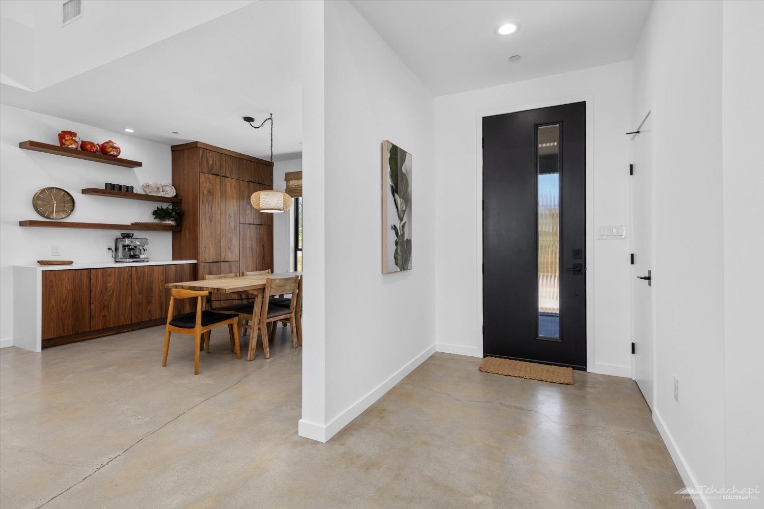 28901 Augusta Way Tehachapi, CA 93561 - Photo 17 of 65 wooden floor in kitchen and an empty room