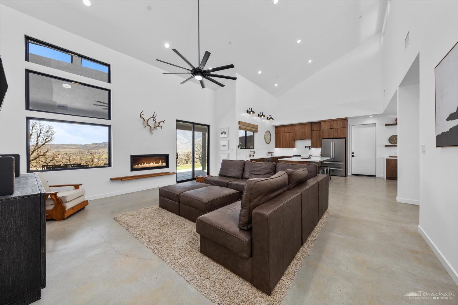 28901 Augusta Way Tehachapi, CA 93561 - Photo 21 of 65 a living room with furniture and a flat screen tv