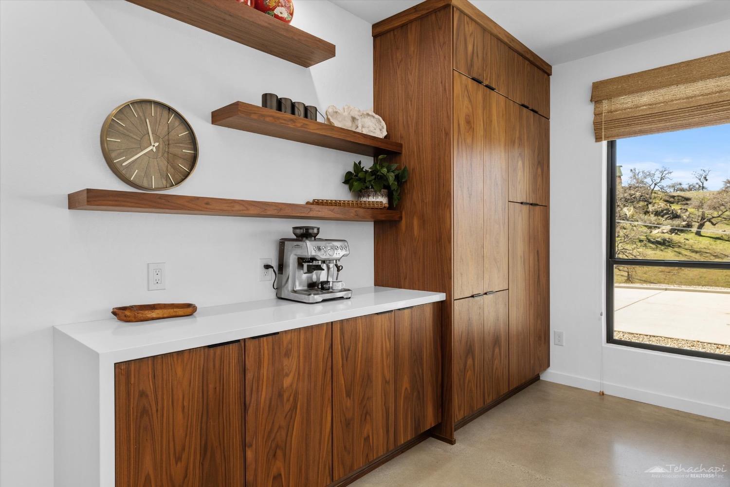 28901 Augusta Way Tehachapi, CA 93561 - Photo 26 of 65 a kitchen with a refrigerator and a stove