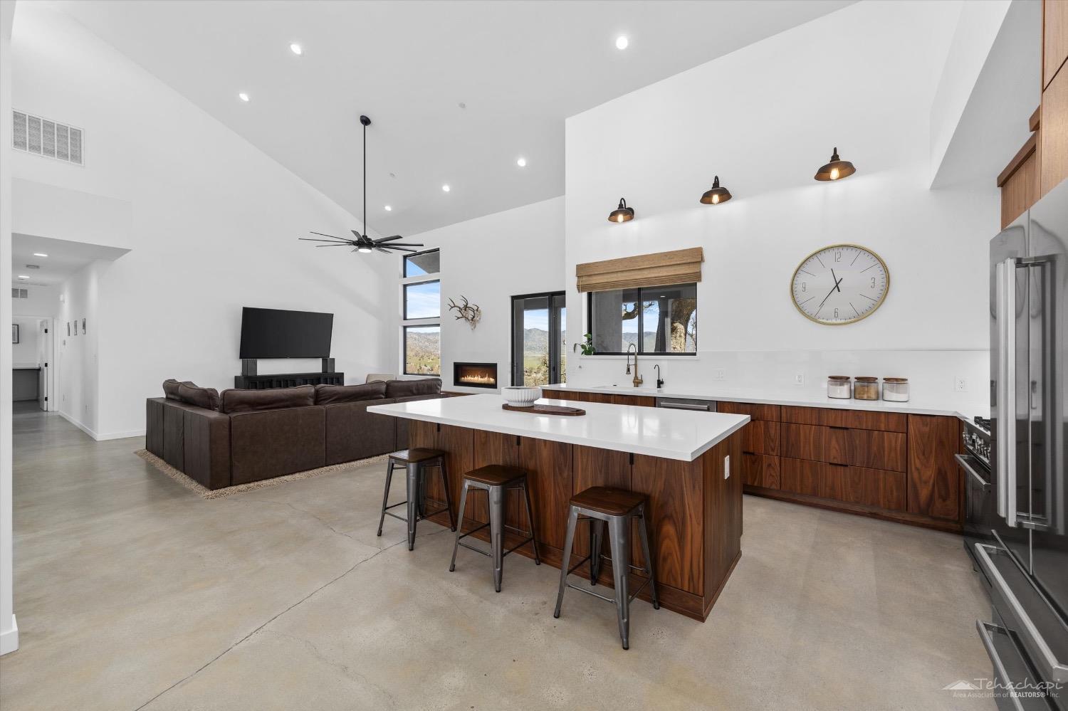 28901 Augusta Way Tehachapi, CA 93561 - Photo 30 of 65 a large kitchen with a table and chairs in it