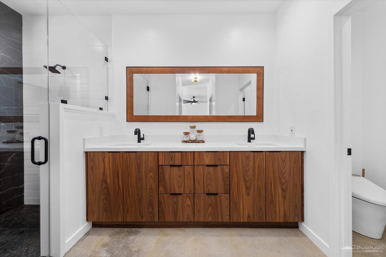 28901 Augusta Way Tehachapi, CA 93561 - Photo 37 of 65 a bathroom with a sink and a mirror