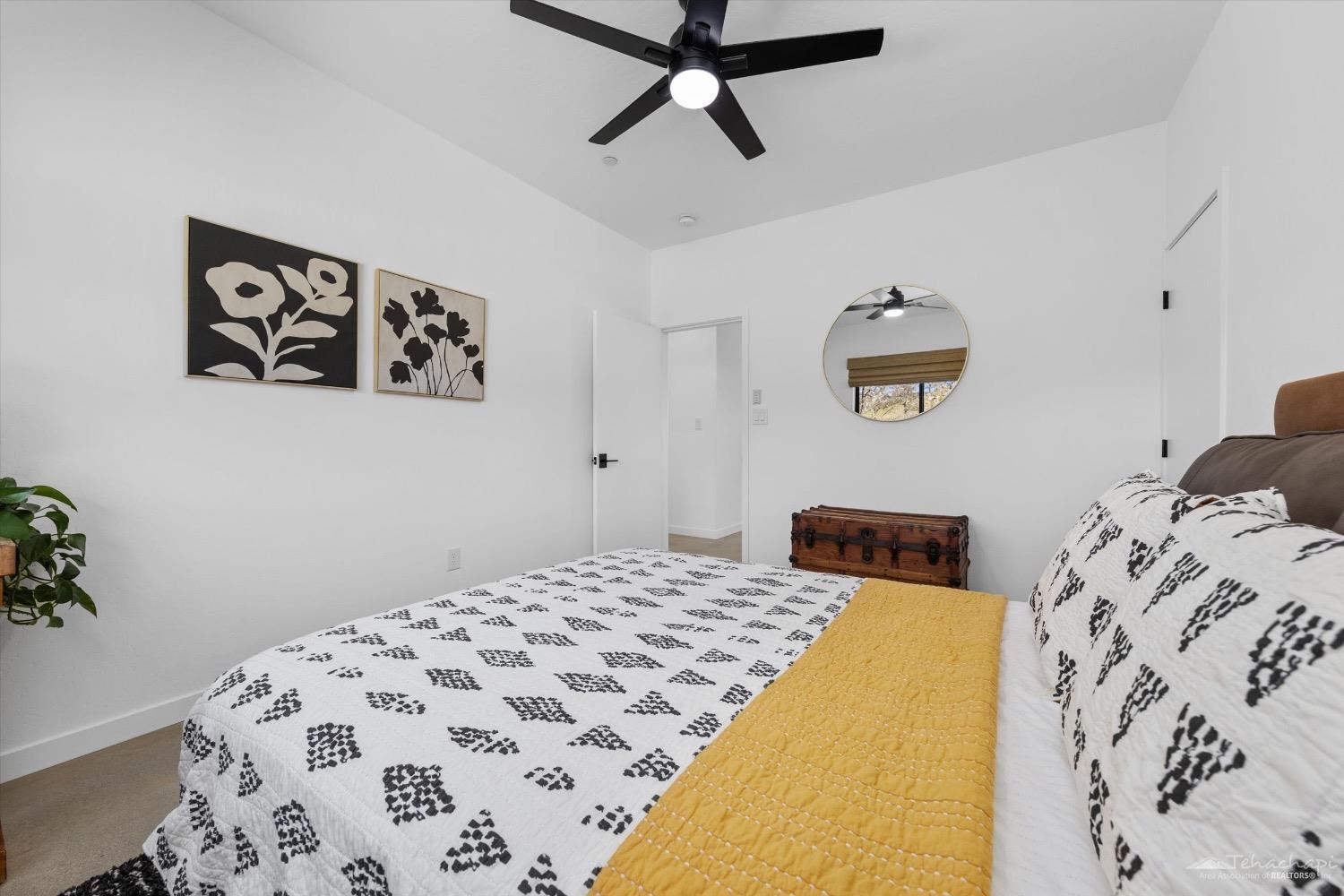 28901 Augusta Way Tehachapi, CA 93561 - Photo 42 of 65 a bedroom with a bed and a window