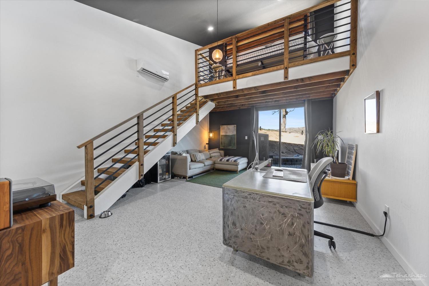 28901 Augusta Way Tehachapi, CA 93561 - Photo 50 of 65 a living room with furniture and a flat screen tv