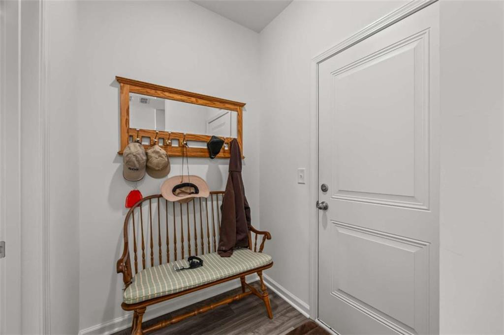 16 Casteel Circle Bethlehem, GA 30620 - Photo 11 of 48 a view of a hallway with a door and wooden floor