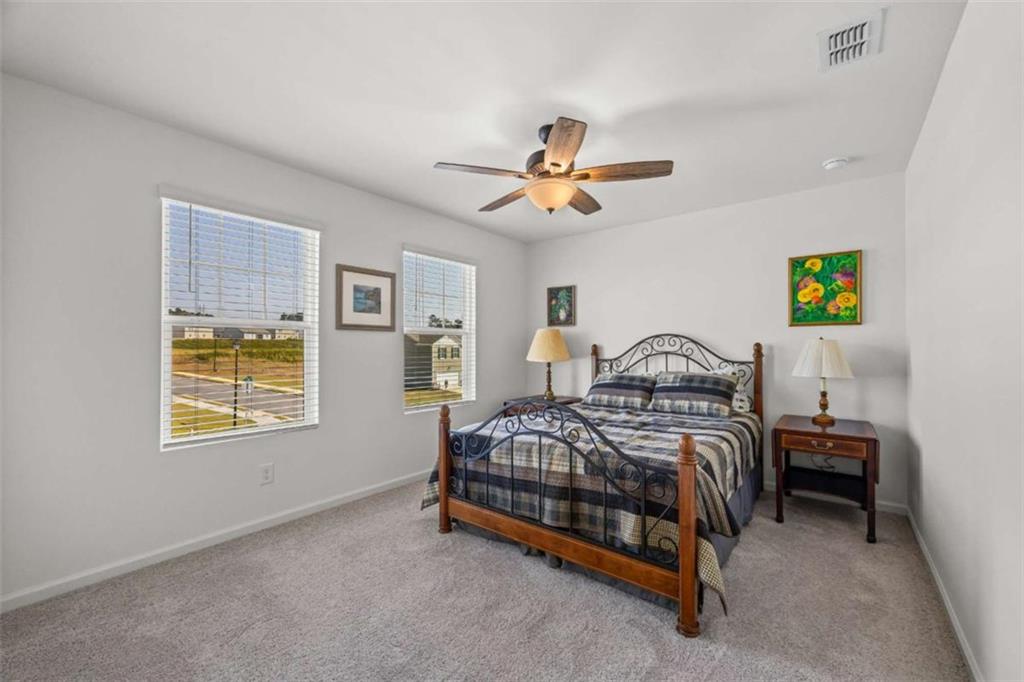 16 Casteel Circle Bethlehem, GA 30620 - Photo 13 of 48 a bedroom with a bed and a chandelier