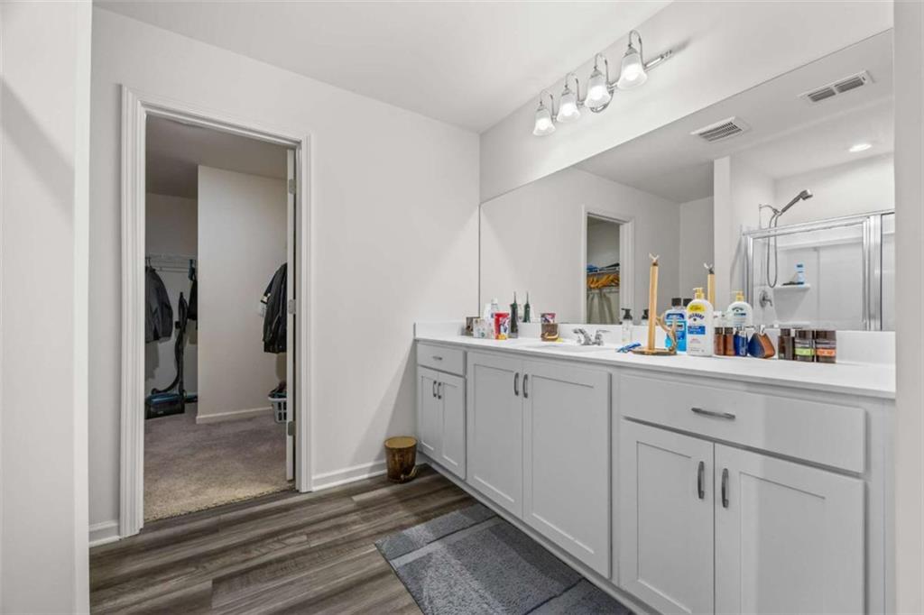 16 Casteel Circle Bethlehem, GA 30620 - Photo 18 of 48 a spacious bathroom with a shower sink and mirror