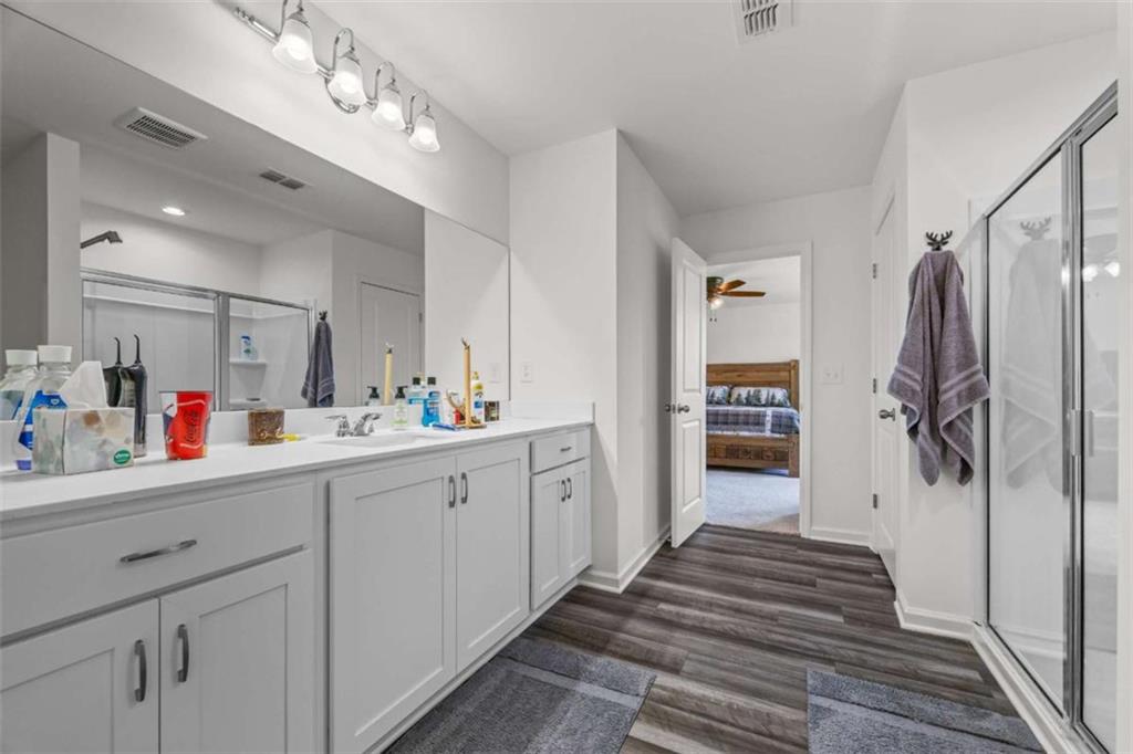 16 Casteel Circle Bethlehem, GA 30620 - Photo 19 of 48 a bathroom with a sink a mirror and shower