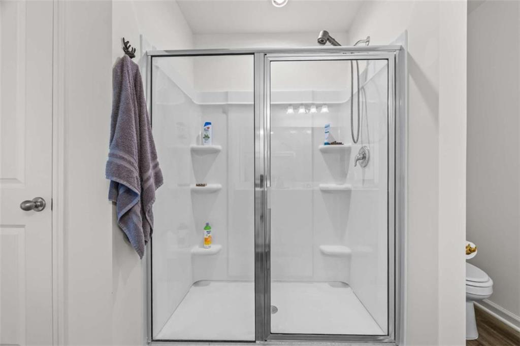 16 Casteel Circle Bethlehem, GA 30620 - Photo 20 of 48 a bathroom with a glass shower door