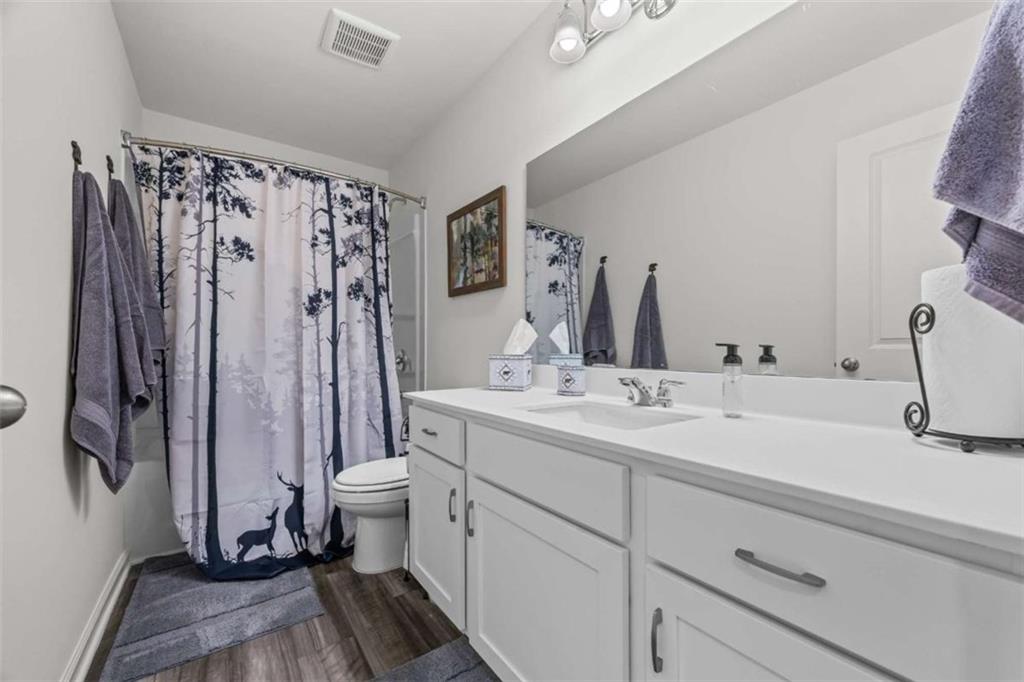 16 Casteel Circle Bethlehem, GA 30620 - Photo 27 of 48 a bathroom with a double vanity sink and mirror