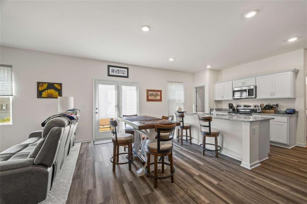 16 Casteel Circle Bethlehem, GA 30620 - Photo 3 of 48 a view of a dining room with furniture window and wooden floor