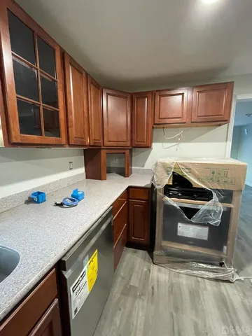 a kitchen with a stove a sink and a microwave