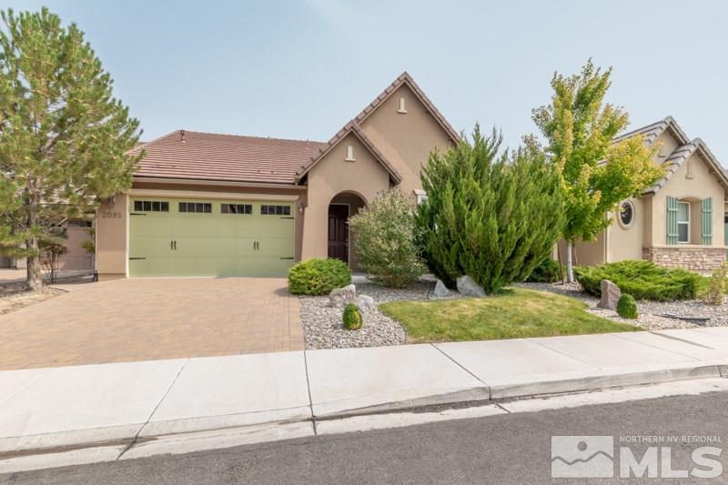 2095 Angel Ridge Drive Reno, NV 89521 - Photo 1 of 30 front view of house next to a yard