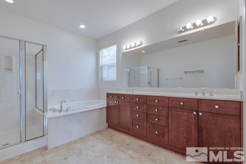 2095 Angel Ridge Drive Reno, NV 89521 - Photo 18 of 30 a spacious bathroom with a tub double sink and mirror