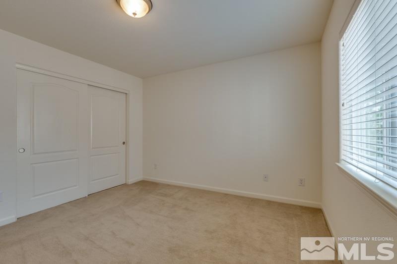 2095 Angel Ridge Drive Reno, NV 89521 - Photo 22 of 30 an empty room with windows