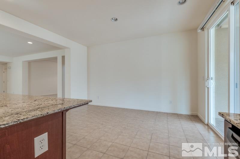 2095 Angel Ridge Drive Reno, NV 89521 - Photo 10 of 30 a view of kitchen island granite countertop cabinets and sink