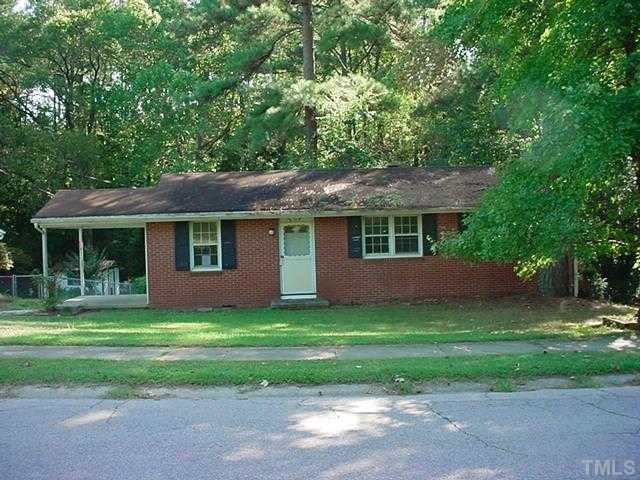 1214 Marlborough Road Raleigh, NC 27610 - Photo 1 of 4 a front view of a house with a yard and trees