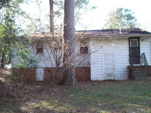 1214 Marlborough Road Raleigh, NC 27610 - Photo 2 of 4 a front view of a house with a garden