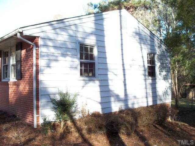 1214 Marlborough Road Raleigh, NC 27610 - Photo 3 of 4 a view of a house with a yard