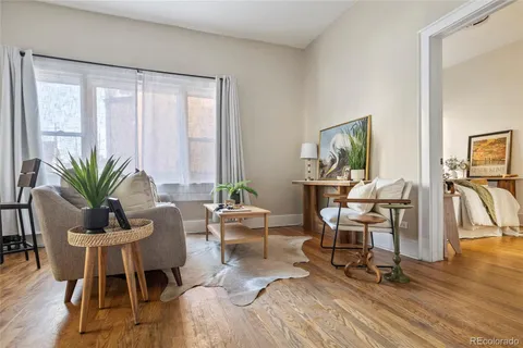 a view of a livingroom with furniture and a window